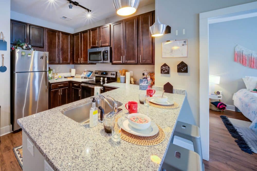 the eastern on 10th off campus apartments near east carolina university ecu fully equipped kitchen faux stainless appliances granite countertops